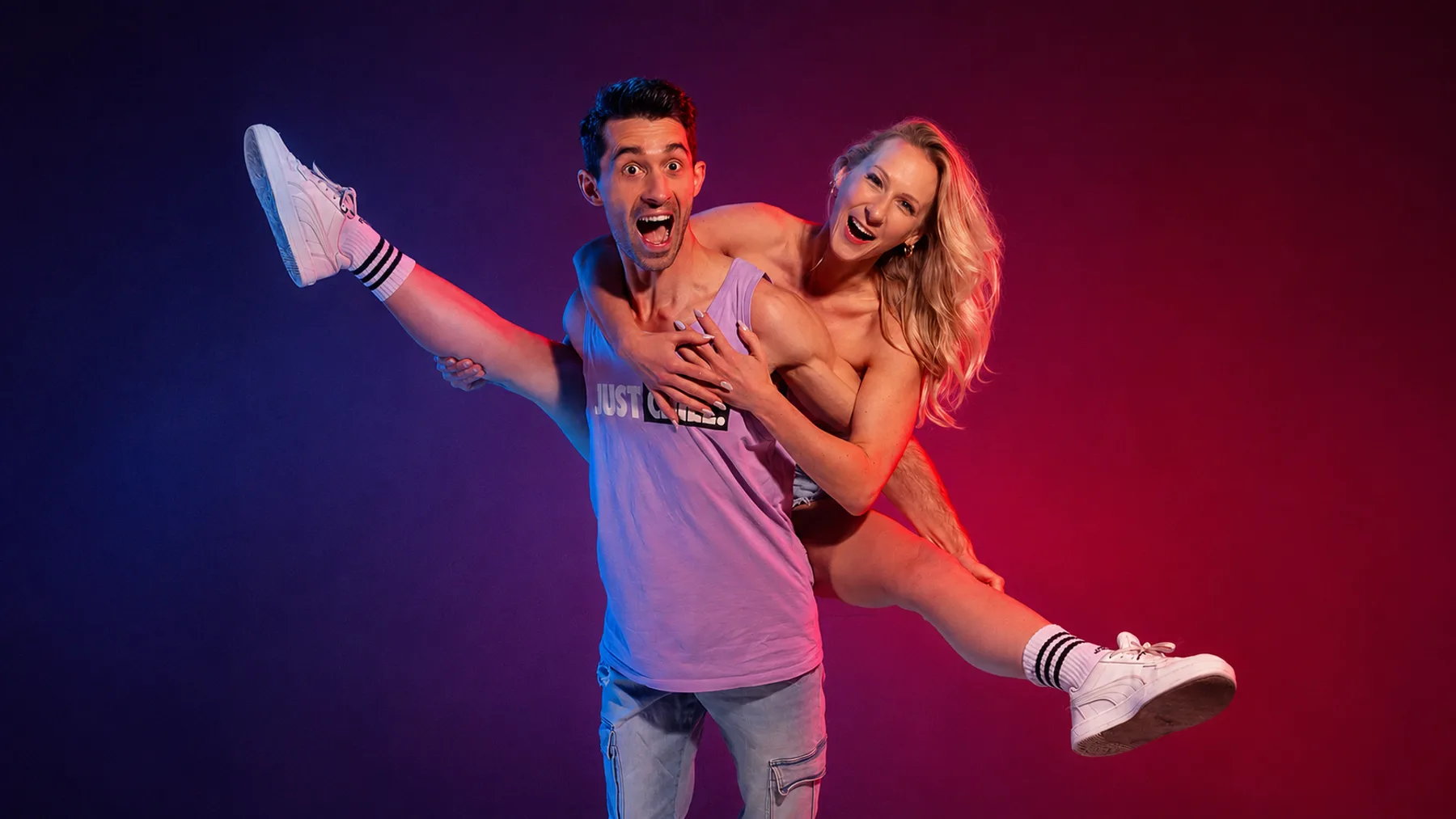 Alexej & Florence playfully lifted off the floor — Brazilian Zouk private lessons under studio lighting
